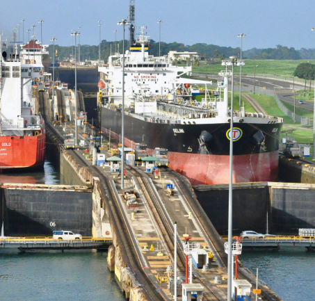 Cargo ships passing through a major canal in Latin America